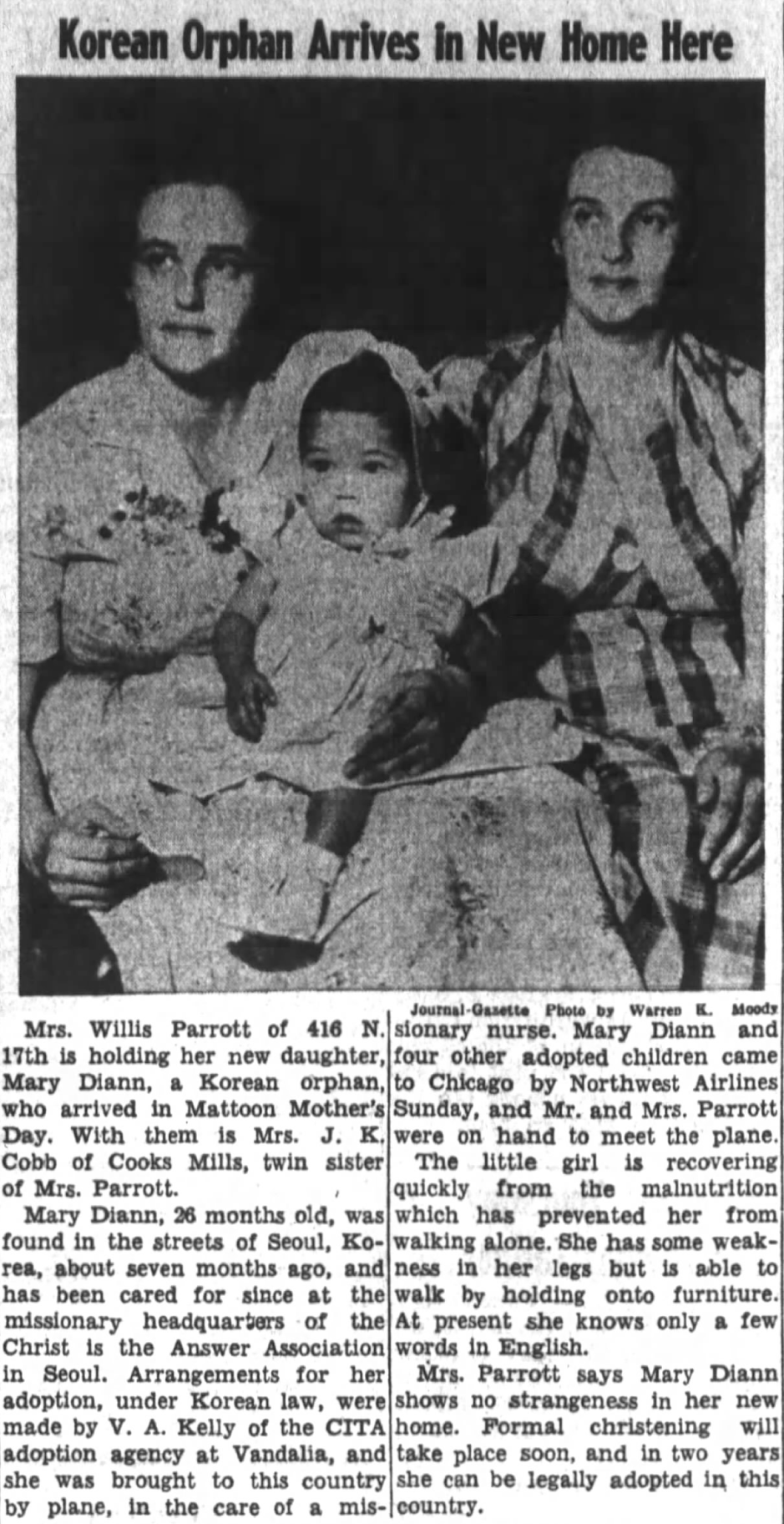 Korean orphan arrive sin new home here